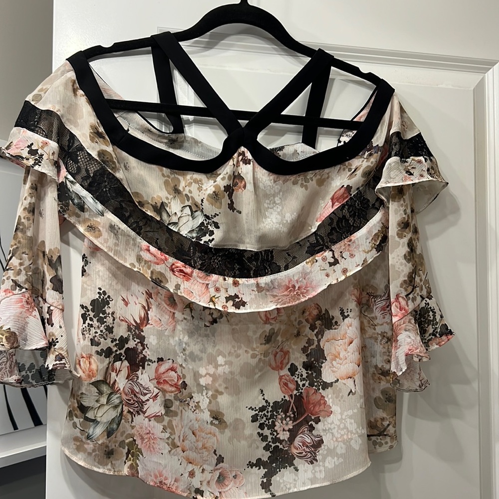 Soft Sheer floral cold shoulder blouse with lace detail.